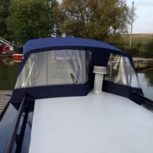 Narrowboat pram with flue design