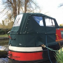 Narrowboat pram with spray dodger to outside